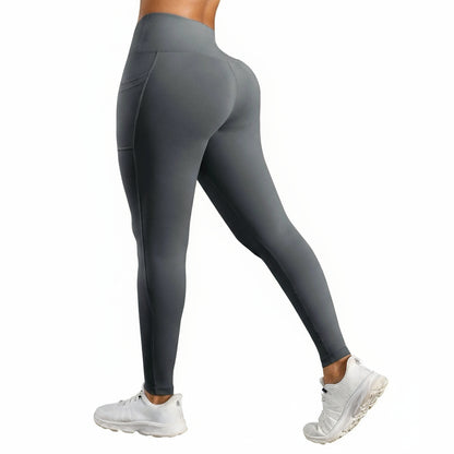 Gray leggings worn by a person on a white background