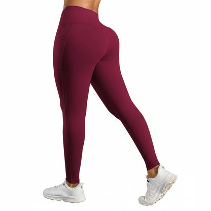 Maroon leggings worn by a person on a white background