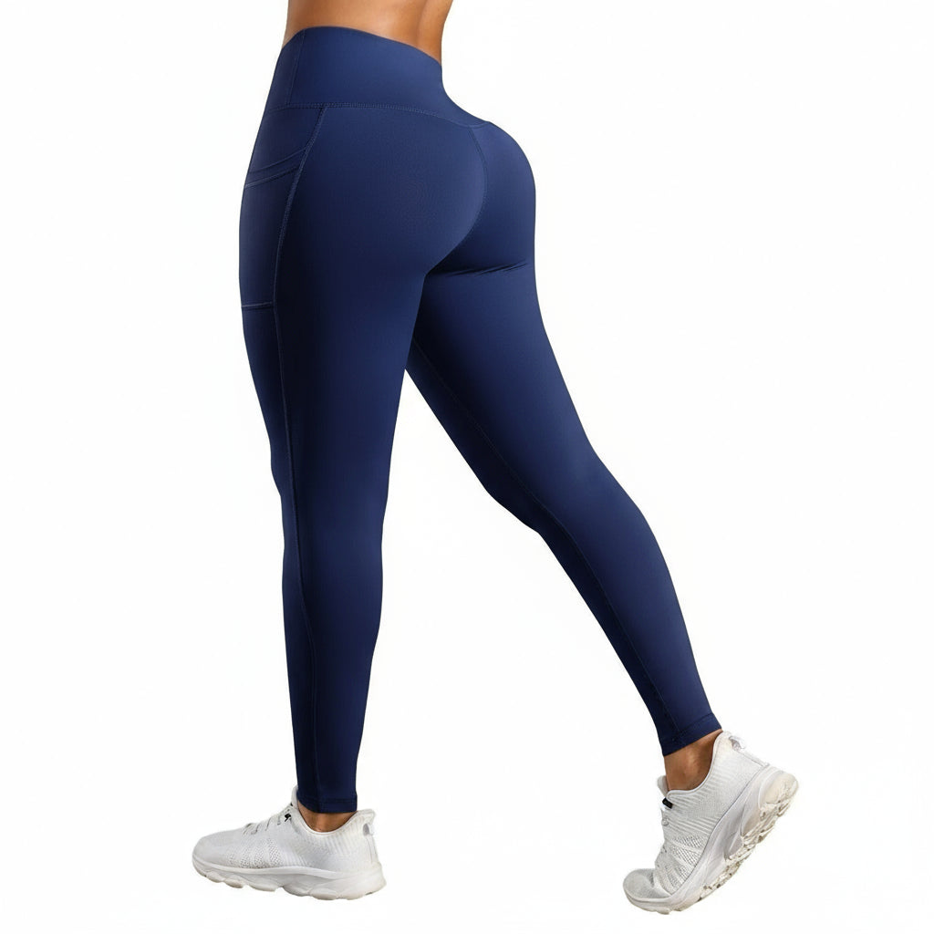Navy blue leggings worn by a person with a white background